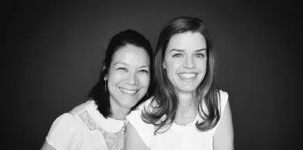 photo of two women on black background