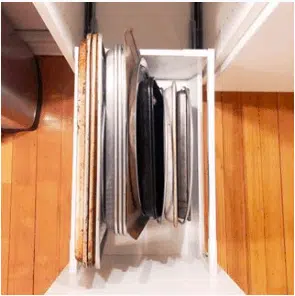 a baking drawer with organized cookie sheets