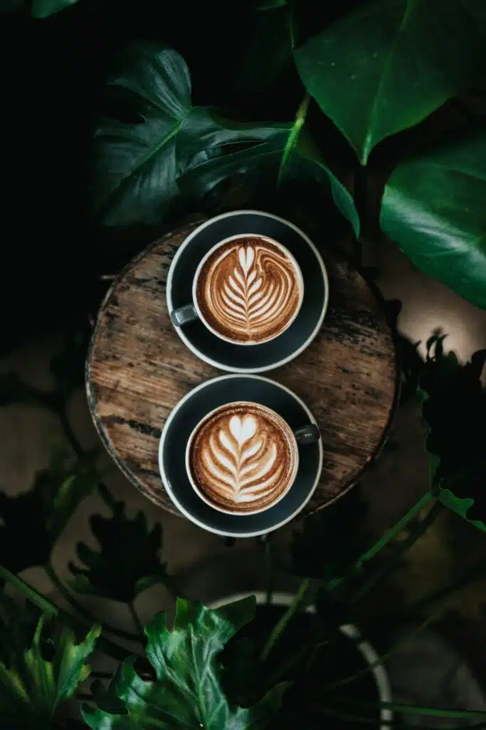 two cups of coffee with milk hearts