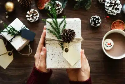 holiday gift package with pinecone decoration