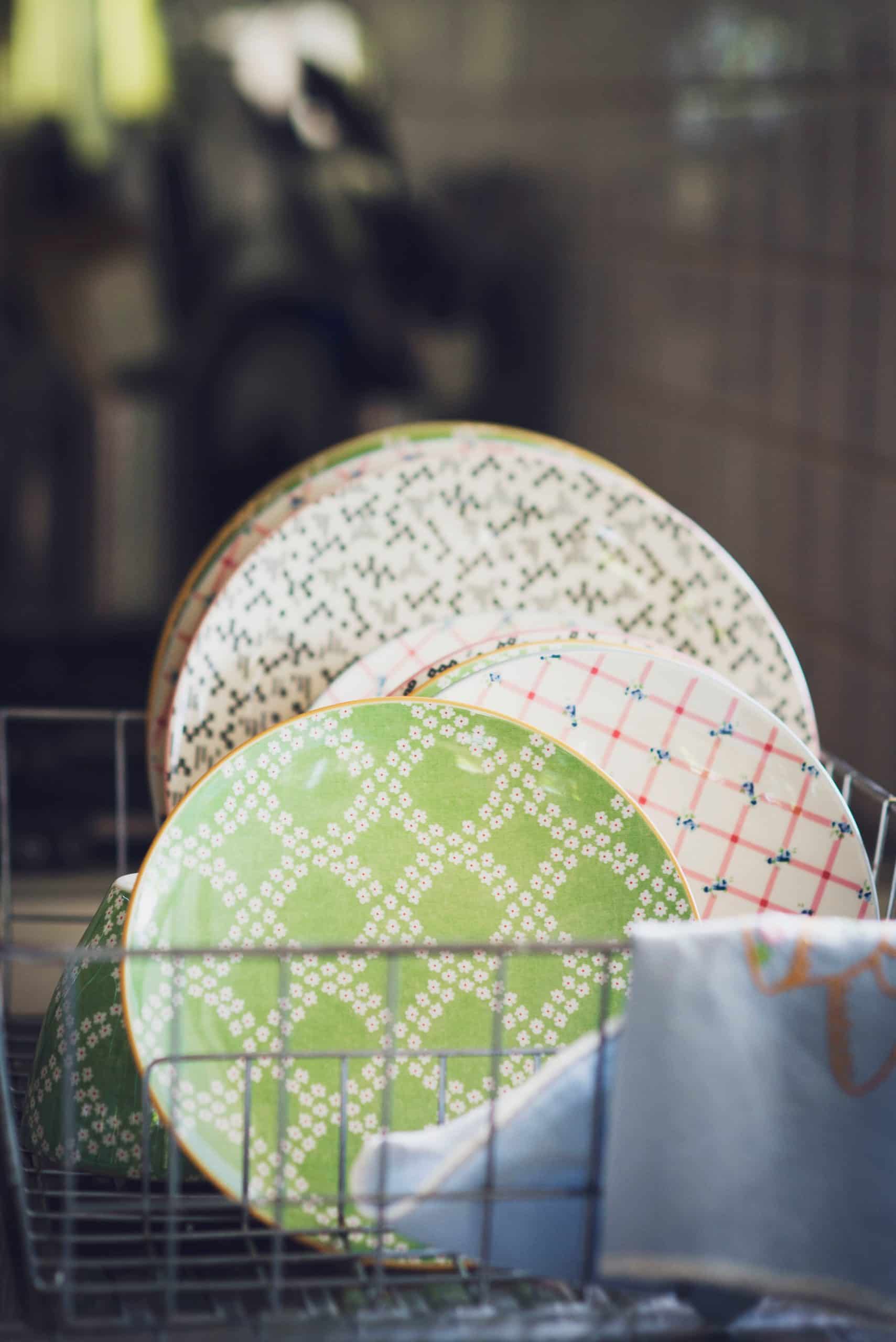 colorful dishes in a drying rack